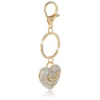 Gold-Tone Pave Heart Keychain Bag Charm & Earrings Set Gold-Tone Pave Heart Keychain Bag Charm & Earrings Set